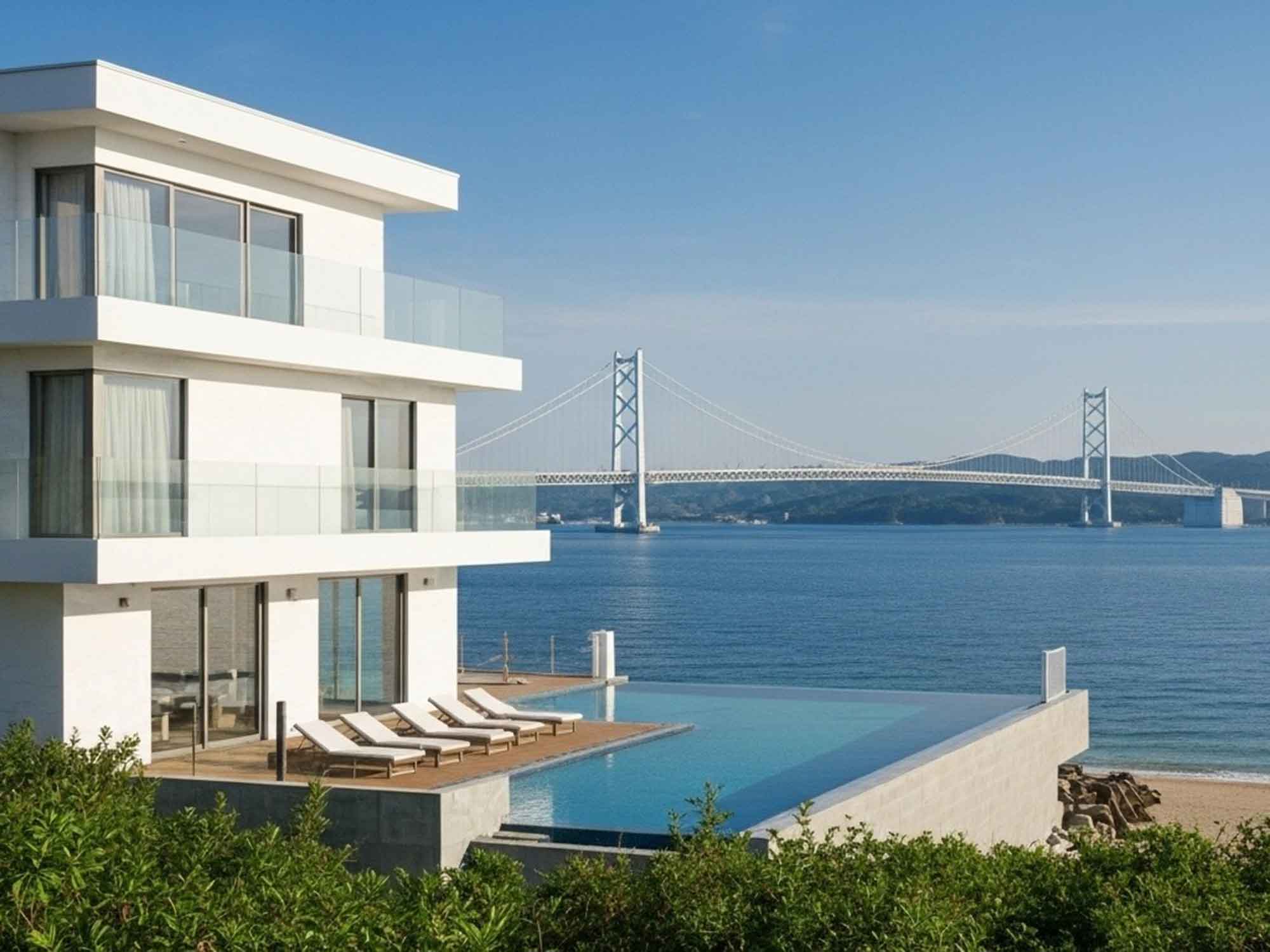 淡路島の海沿いに建つモダンなヴィラインフィニティプールと海明石海峡大橋が見える絶景ロケーションバーベキューを楽しめる人気リゾートの外観